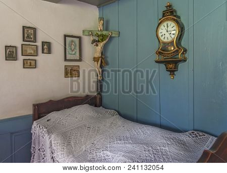 Hoffstetten Bei Brienz, Switzerland - April 2017: Bedroom With Cricifixion In Ballenberg Open Air Mu