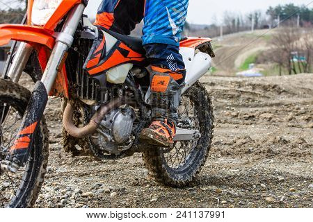 Biker Is Rides On His Colorful Sport Motorcycle On Summer Street. Man Wearing Protective For Bikers.