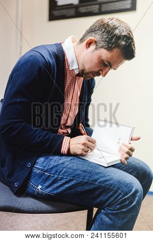Vilnius, Lithuania - May 4, 2016: Sasha Filipenko Belorussian Novelist And Journalist Autographing H