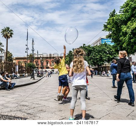Palermo, Italy - April, 2018: Street Artist Making Soap Bubbles On The Street In Piazza Giuseppe Ver