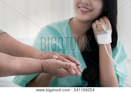 Mother Hands Holding Her Daughter Patient Hand Sitting At The Desk For Encouragement, Empathy, Cheer