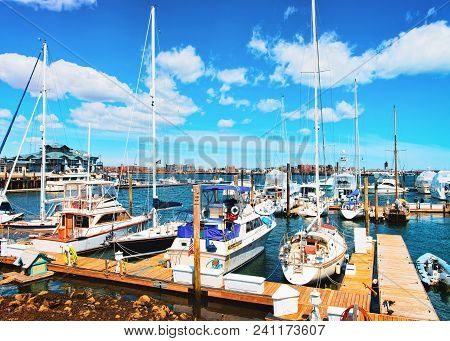 Pier Of The Long Wharf With Custom House Block And Sailboats In Charles River In Boston, Massachuset