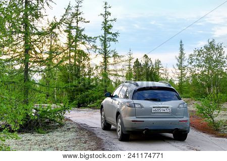 Novyy Urengoy, Russia - June 26, 2017: Motor Car Infiniti Fx35 In The Forest At The Background Of Th