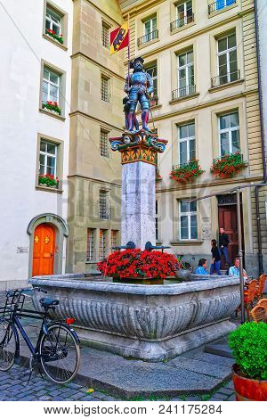 Bern, Switzerland - August 21, 2013: Banneret Fountain On Rathausplatz In Old City Center In Bern, S