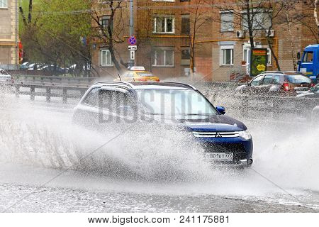 Moscow, Russia - May 2, 2018: Motor Car Mitsubishi Outlander In The City Street During A Heavy Rain.