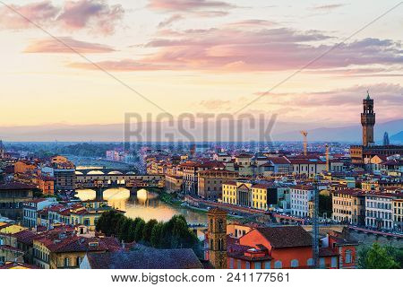 Ponte Vecchio Bridge And Palazzo Vecchio In Florence In Italy. At Sunset