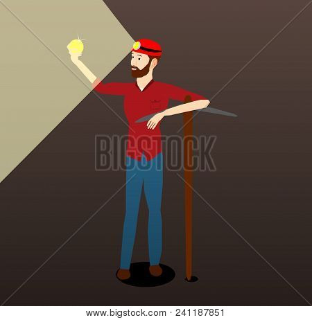 The Miner Holds The Coin In His Hands And Looks With The Help Of Lighting From The Lantern.