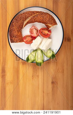 Breakfast With Feta Cheese,  Simit, Cucumber, And Cherry Tomoto  Isolated On Wooden Background Top V