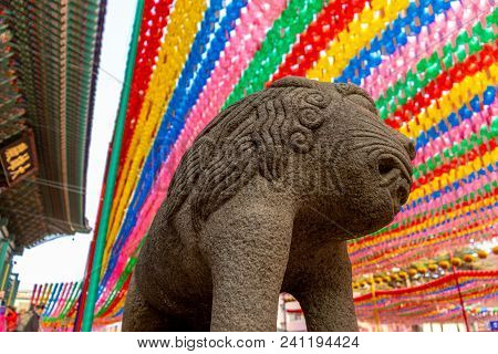 Asian Lion Stone Statue  At A Buddhist Temple