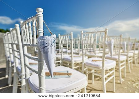 Beach Wedding Venue Setup With Modern Style Of White Chiavari Chairs With Cone Of Rose Petal Hanging