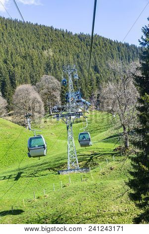 Cable Car And Tower Over Small Village On Mountain Alps, Transpotation From Grindelwald To First Pea