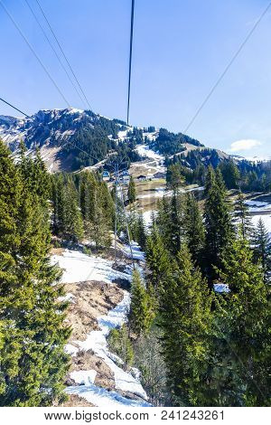 Cable Car And Tower Over Small Village On Mountain Alps, Transpotation From Grindelwald To First Pea