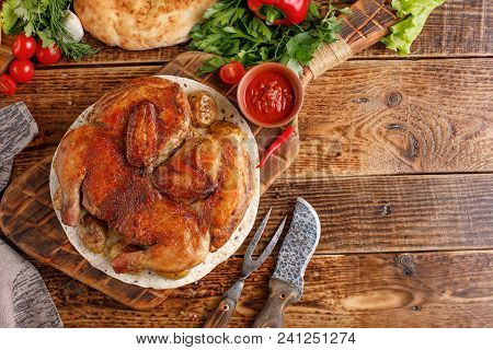 Chicken Of Tobacco On A Wooden Background. Still Life With Textiles And Original Appliances. Place U