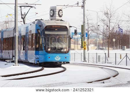 Solna, Sweden - February 27, 2018: Stockholm Transport Suburban Rapid Transit Tramway With A Blue Tr