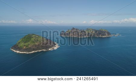 Small Rocky Islands In The Sea, Blue Sky And Clouds. Dos Hermanas, Palau, Santa Ana. Aerial View Of 