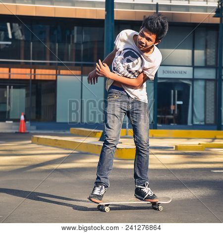 Bonifacio Global City, Taguig City, April 2, 2015: Skater Practicing In A Parking Lot In Bonifacio G