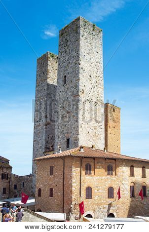 San Giminiano, Italy - May 26, 2016: The Famous Medieval Towers Of The Old Town, Seen From Duomo Squ