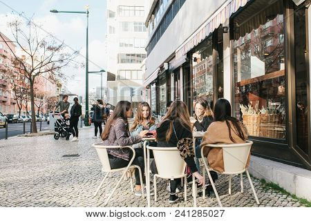 Lisbon, Portugal 01 May 2018: Friends Or Girlfriends Or Group Of Tourists In Cafe Or Cafeteria On St