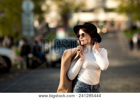 Lifestyle Fashion Portrait Of Young Stylish Hipster Woman Walking On The Street