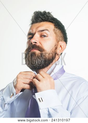 Bearded Man Buttoning His Shirt At Neck. He Is Dressing In Morning. Clothes Detail. Stylish Man Gett