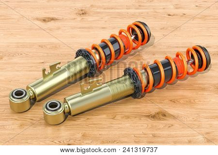 Set Of Front Shock Absorbers On The Wooden Table, 3d Rendering