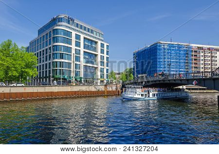 Berlin, Germany - April 22, 2018: River Spree And Its Bank Schiffbauerdamm, Tourists Boats,  Modern 