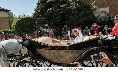 Windsor, England - May 19 2018: Prince Harry, Duke Of Sussex And Meghan, Duchess Of Sussex Leave Win