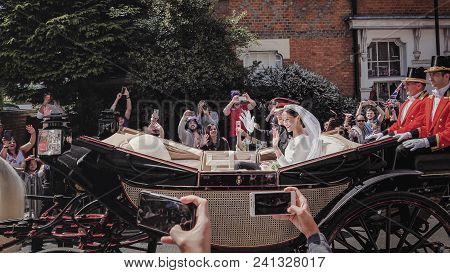 Windsor, England - May 19 2018: Prince Harry, Duke Of Sussex And Meghan, Duchess Of Sussex Leave Win