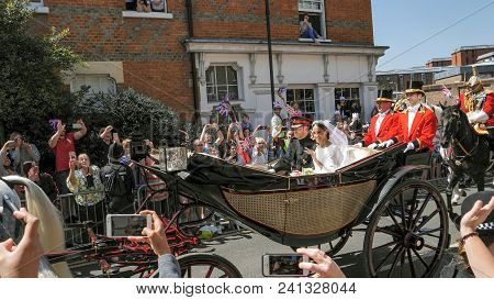 Windsor, England - May 19 2018: Prince Harry, Duke Of Sussex And Meghan, Duchess Of Sussex Leave Win