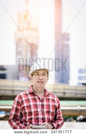 Asian Business And Engineer Man With Red Scott Shirt Has Planning And Working For Design Buiding And