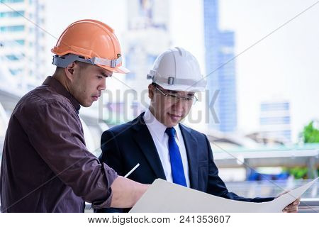 Two Asian Business And Engineer Man Has Planning And Working For Design Buiding And City.