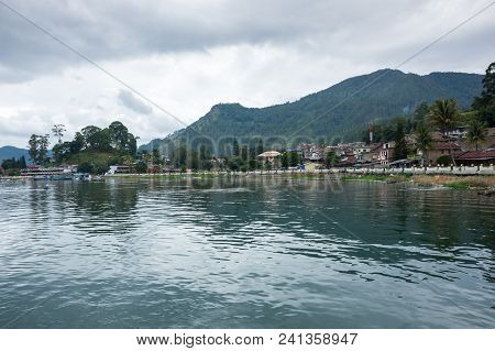 Lake Toba Is A Large Natural Lake Occupying The Caldera Of A Supervolcano, Located In The Middle Of 