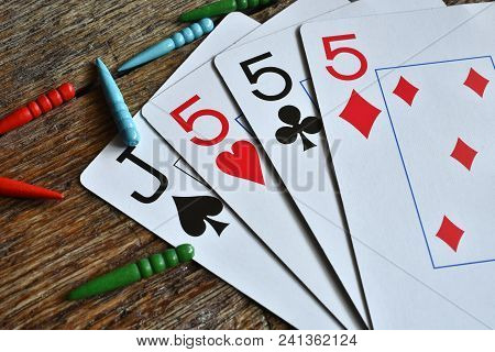 A Close Up Image Of A Winning Card Hand In A Game Of Cribbage.