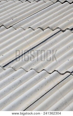 A Fragment Of A Gray Slate Roof Of An Old Sample Made Of Asbestos Material