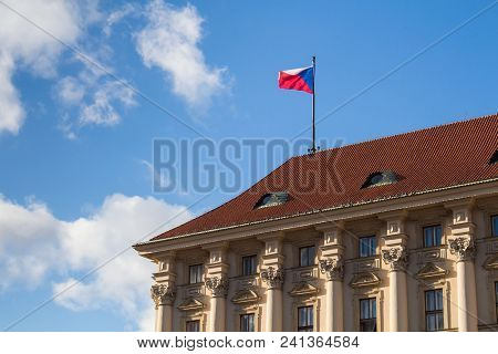 Czech Flag In The Wind On The Roof Of Ministry Of Foreign Affairs In Prague, Czech Republic. Blue Sk