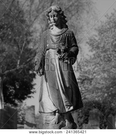 Picture Of A Statue In A Graveyard Black And White