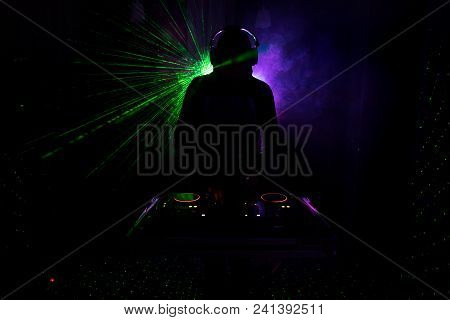 Dj Spinning, Mixing, And Scratching In A Night Club, Hands Of Dj Tweak Various Track Controls On Dj'