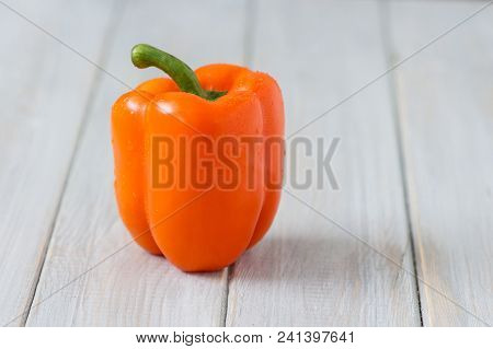 Sweet Orange Peppers On Rustic White Wood Kitchen Table
