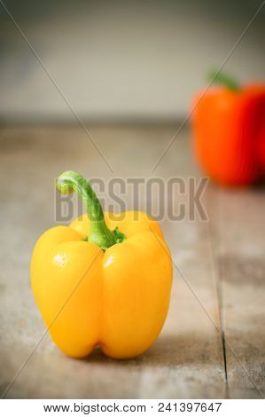 Sweet Peppers On Rustic Wood Kitchen Table
