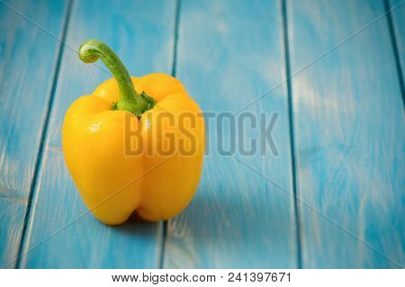 Sweet Yellow Pepper On Rustic Blue Wood Kitchen Table