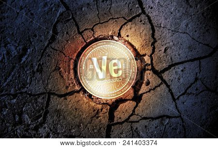 Shiny Golden Veritaseum Cryptocurrency Coin On Dry Earth Dessert Background Mining Crash Photo Compo