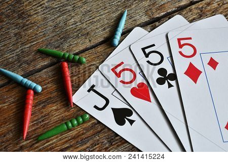 A Close Up Image Of A Winning Card Hand In A Game Of Cribbage.