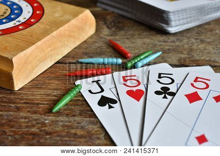 A Close Up Image Of A Winning Card Hand In A Game Of Cribbage.