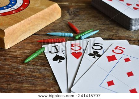 A Close Up Image Of A Winning Card Hand In A Game Of Cribbage.