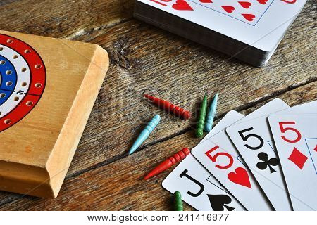 A Close Up Image Of A Winning Card Hand In A Game Of Cribbage.