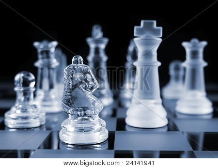 Glass Chess Pieces on a Frosted Glass Chess Board