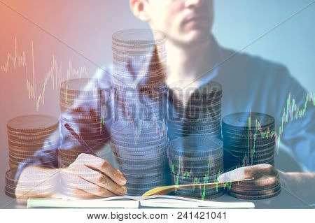 Double Exposure Of Businessman Writhing On Desk And Stock Market Or Forex Graph And Stack Coin Suita