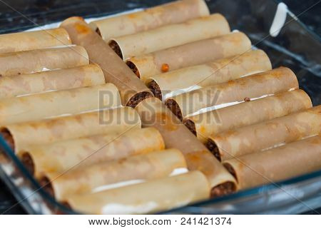 Cannelloni Pasta Unkooked. Food Preparing. Bechamelle Sauce Over Meat Cannelonni.