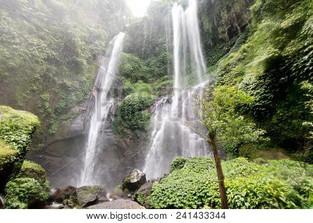 Waterfall In Green Rainforest. Triple Waterfall Sekumpul In The Mountain Jungle. Bali, Indonesia. Tr