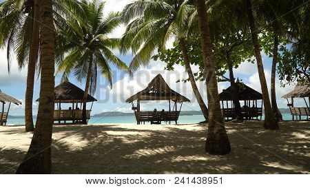 Beach With White Sand With Beach House On A Tropical Island Daco. Beautiful Sky, Sea, Resort. Seasca